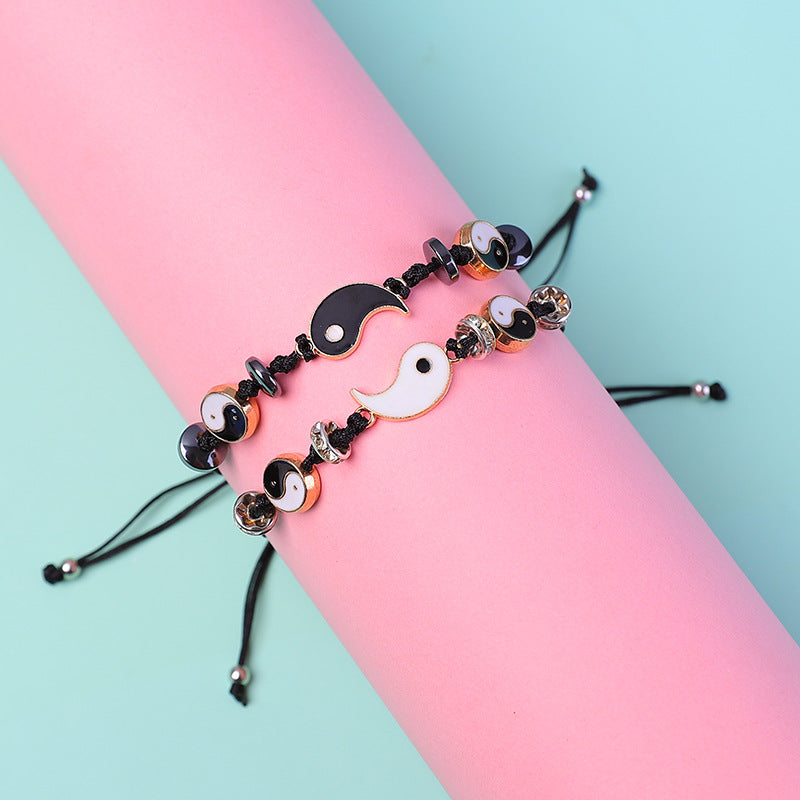 Yin Yang Hematite Bracelet - Beaded charms on pink form with gold-tone beads, pastel background