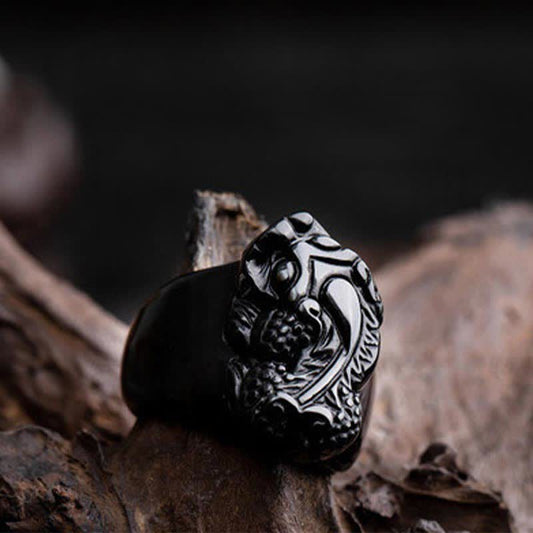 FengShui PiXiu Strength Ring – Glossy black obsidian pixiu ring on driftwood, strength amulet
