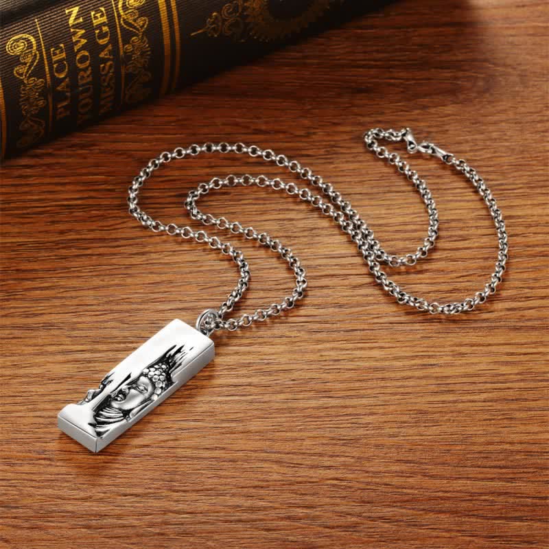 Tathagata Buddha Copper Amulet Necklace – necklace on wooden table beside antique book spine, flatlay, strength