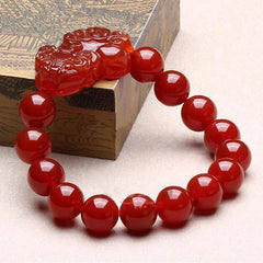Red Agate PiXiu Wealth Luck Bracelet – red agate beads with PiXiu on ornate wooden box, Feng Shui bracelet