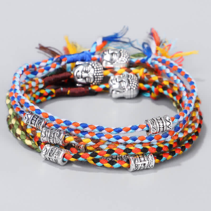 Buddha Head Serenity String Bracelet – Stack of multicolor braided bracelets with silver Buddha heads, vibrant collection