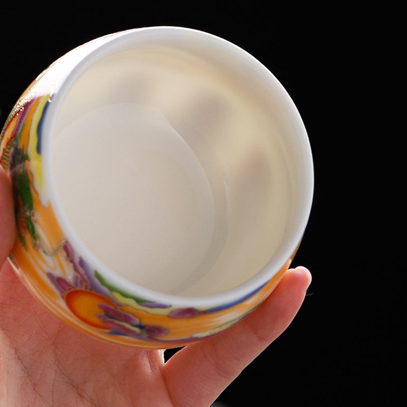 Dragon Phoenix Ceramic Teacup - Overhead view of colorful exterior and white interior, artisan