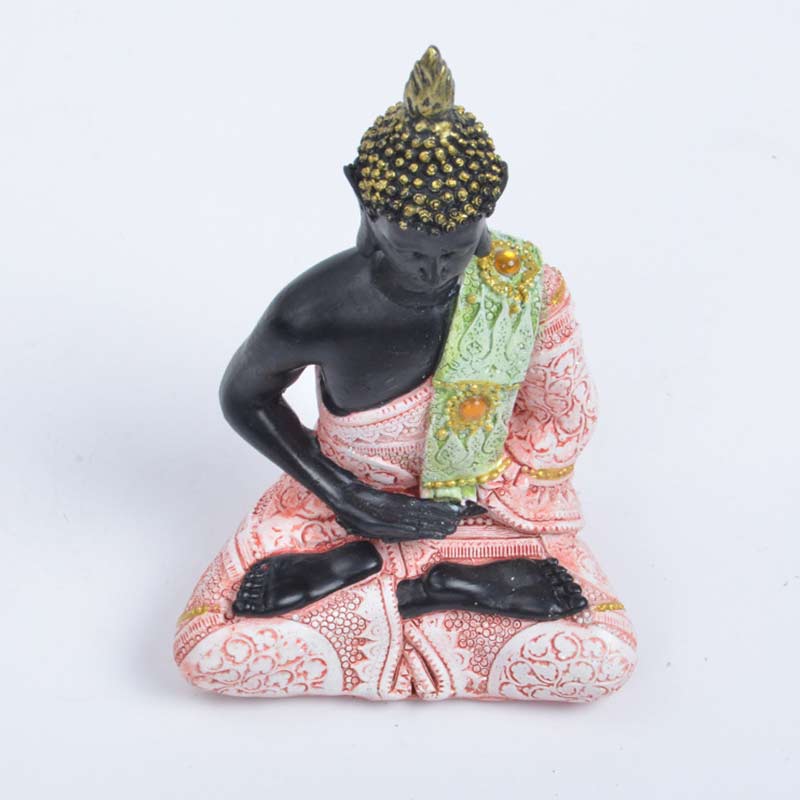 Tibetan Buddha Resin FengShui Decoration – angled view of black resin Buddha with ornate green-pink sash, white studio backdrop, Zen accent