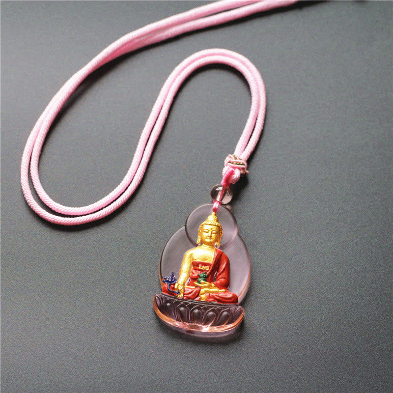 Liuli Crystal Medicine Buddha Pendant – pink cord variant with translucent purple liuli base, flatlay
