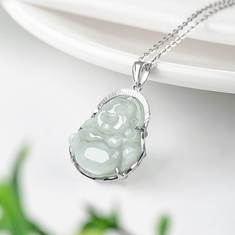 Jade Laughing Buddha Necklace - pendant suspended from white ceramic dish edge revealing jade translucency, luck