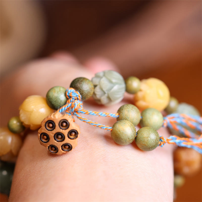 Bodhi Seed Green Sandalwood Lotus Bracelet – stacked on wrist with lotus pod dangle, Bohemian