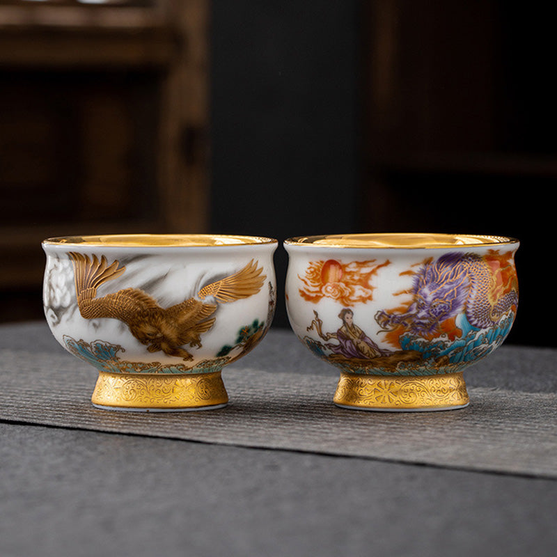 Golden Eagle Dragon Gilt Ceramic Teacup – pair of cups with eagle and purple dragon motifs, gold interiors, pedestal bases, luxury