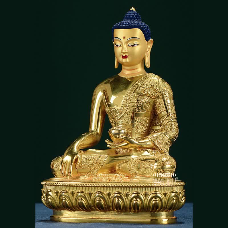 Shakyamuni Enlightenment Copper Statue – displayed on brocade cloth with offering bowl, puja altar setup