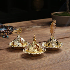 Mini Alloy Incense Burner – gold dome censers trio with pierced lids on wooden table, beads nearby