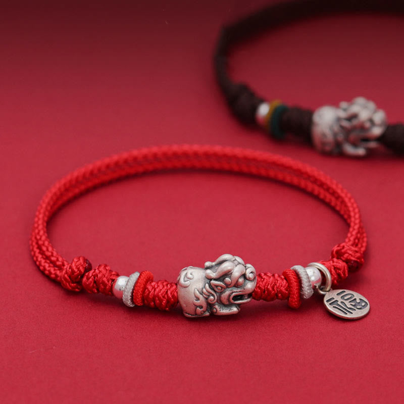 925 Silver PiXiu Fu Bracelet – Red cord with silver PiXiu and Fu tag on red background, luck jewelry