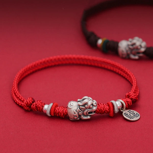 925 Silver PiXiu Fu Bracelet – Red cord with silver PiXiu and Fu tag on red background, luck jewelry