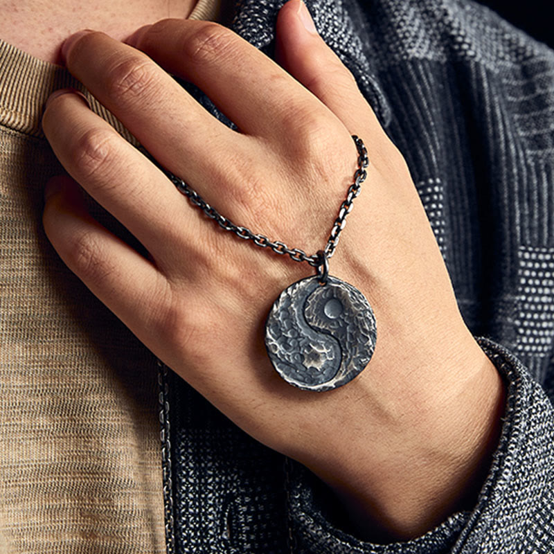 Sterling Silver Yin Yang Necklace – Hand-on-chest lifestyle shot, thick cable chain, hammered texture detail