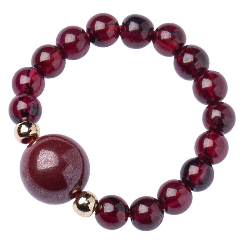 Garnet Cinnabar Ring – cinnabar bead ring isolated white background, minimalist protection view