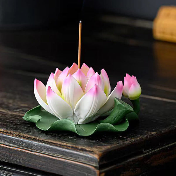 Lotus Ceramic Incense Burner - side view of pink lotus with incense stick, green leaf base, dark wood