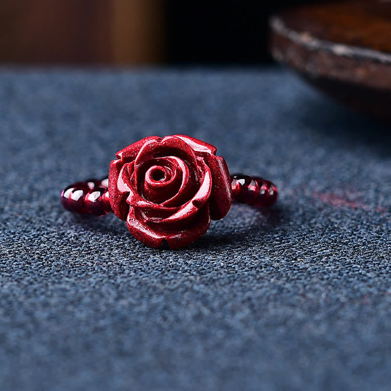 Garnet Cinnabar Ring – cinnabar rose ring front view blue fabric, romantic healing accessory