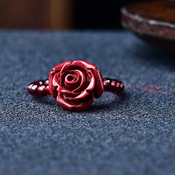 Garnet Cinnabar Ring – cinnabar rose ring front view blue fabric, romantic healing accessory