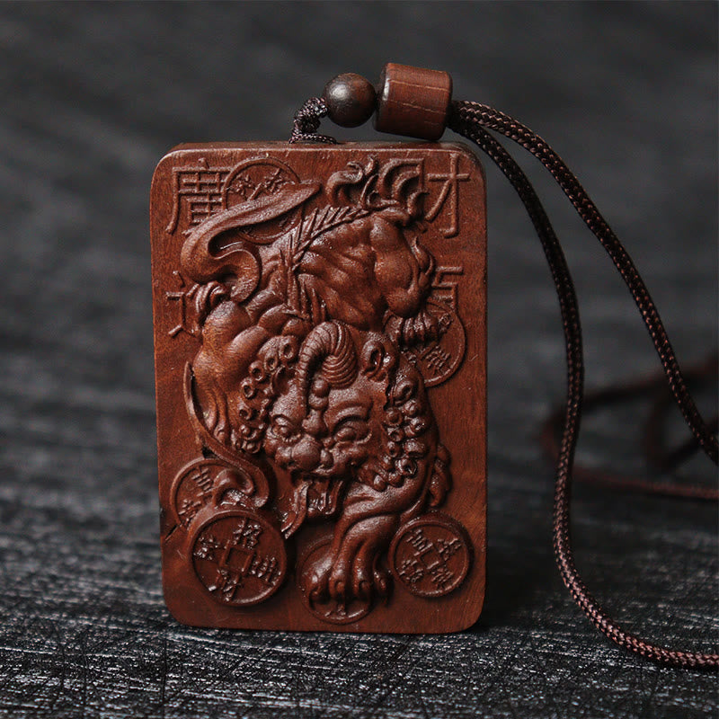 Lightning Struck Jujube Wood PiXiu – Wood PiXiu pendant with cord on dark surface