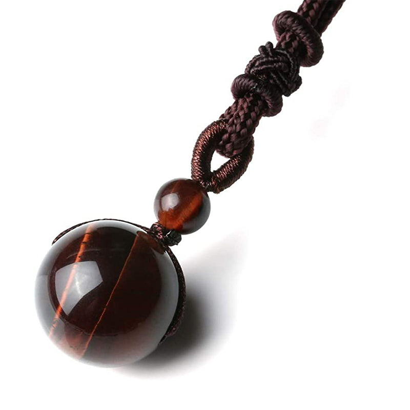 Tibetan Tiger Eye Obsidian Amethyst Protection Necklace – Close-up of deep reddish-brown tiger's eye sphere pendant with chatoyant streaks on braided cord