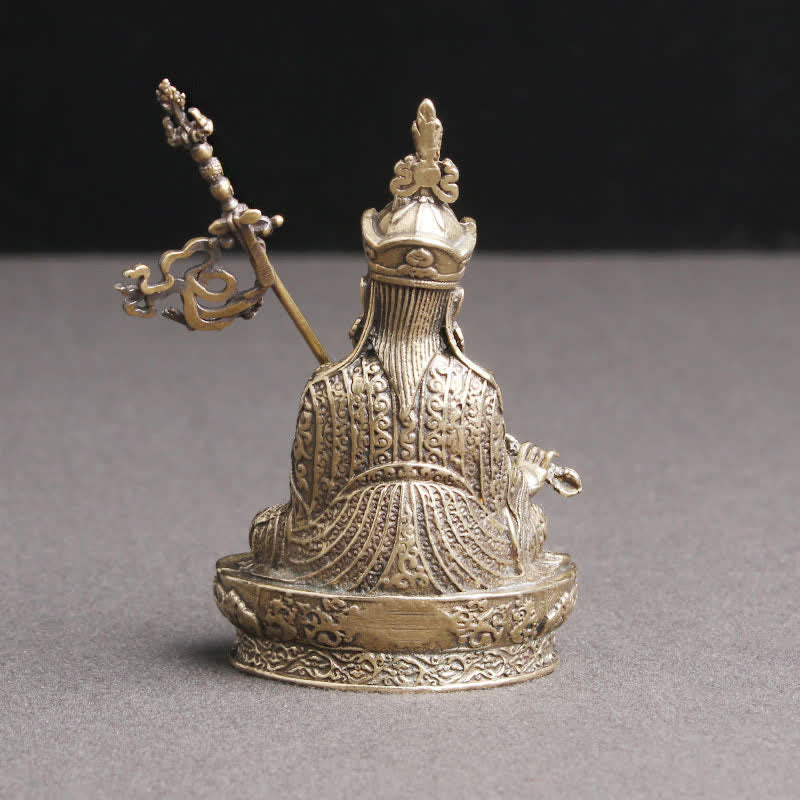 Padmasambhava Buddha Copper Statue – hand holding lotus flower close-up, religious art craftsmanship