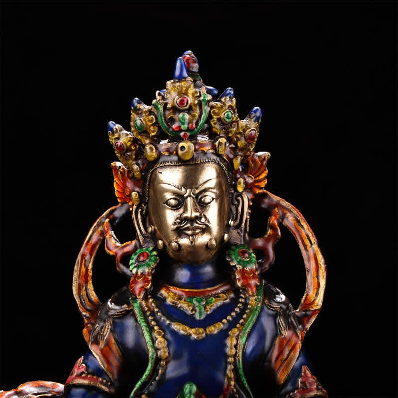 Yellow Jambhala Copper Statue – hand holding wish-fulfilling jewel close-up, abundance prosperity charm