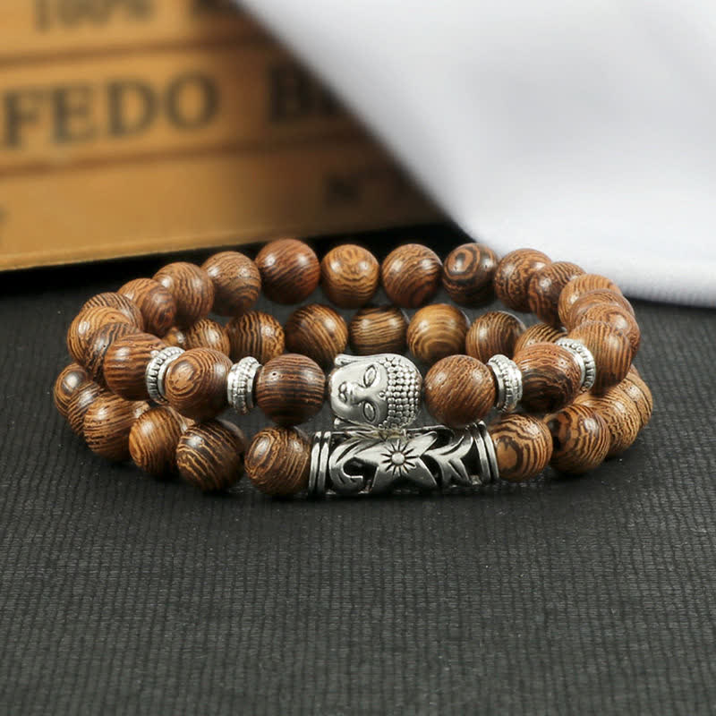 Tiger Eye Bracelet – Wenge wood Buddha bracelet on dark fabric with book backdrop, earthy flatlay