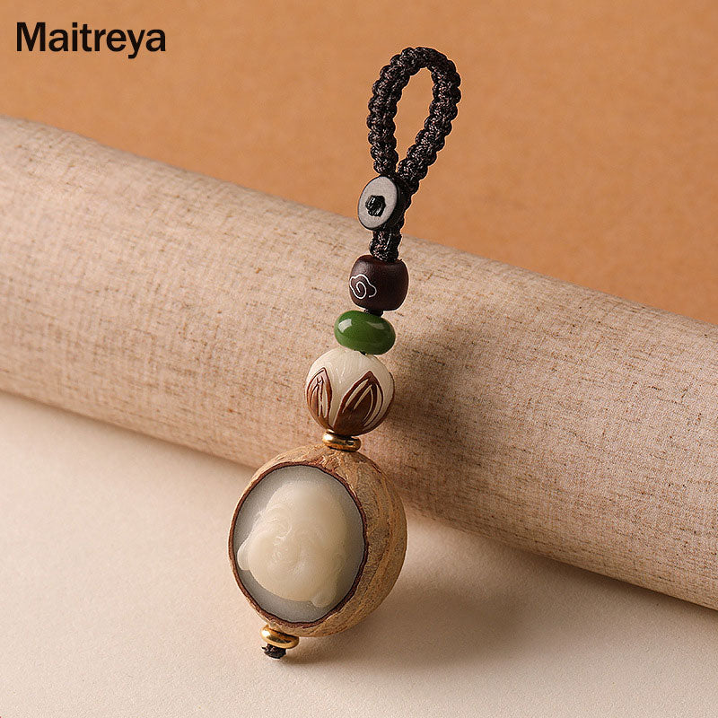 Bodhi Seed Blessing Keychain - Maitreya Buddha carving in organic seed shell with green aventurine and lotus bead accents, joy