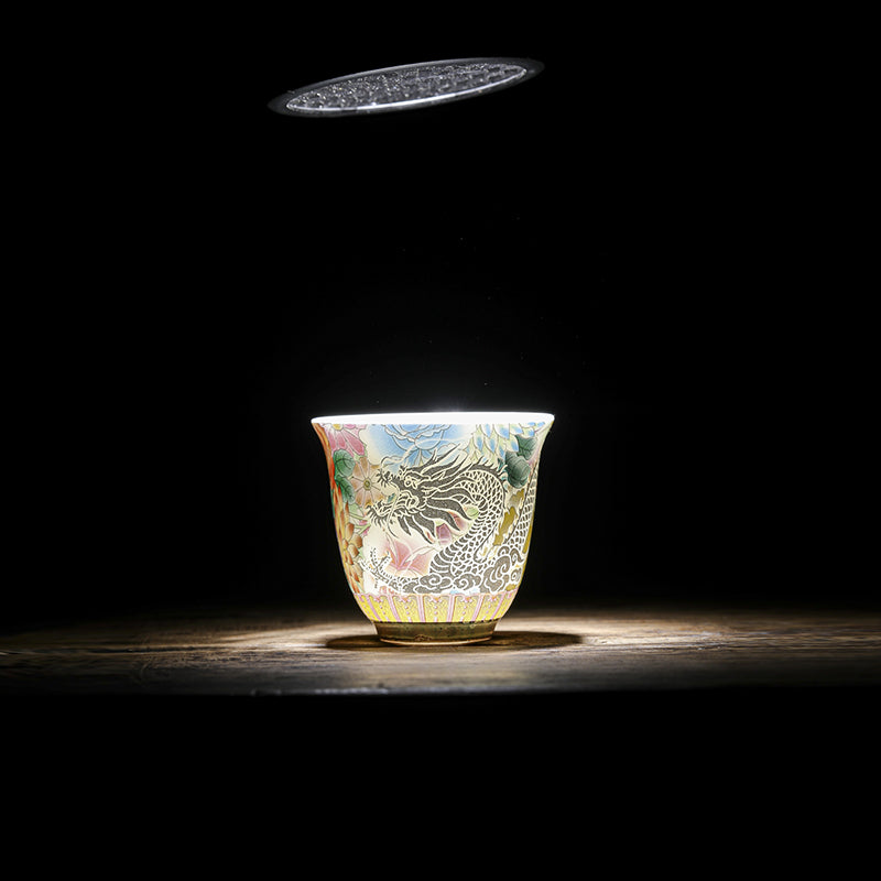 Dragon Phoenix Ceramic Teacup - Backlit cup glowing with translucent dragon on dark wood, Dramatic elegance