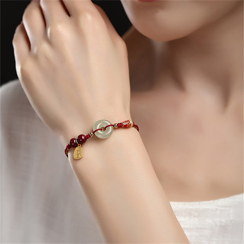 Koi Fish Jade – Side angle showing jade disc and fish charm, 925 silver bracelet