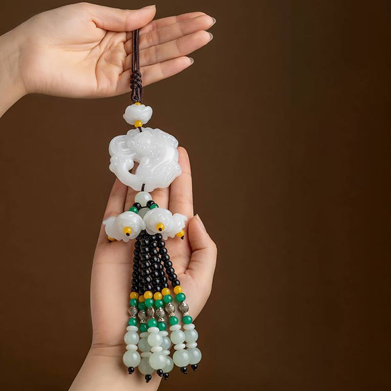 FengShui Jade PiXiu Car Pendant – two hands displaying white jade ornament, full length tassel view, prosperity charm