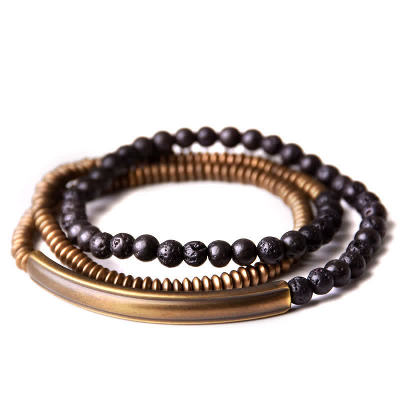 Lava Rock Copper Healing Bracelet – Black lava beads with copper wire-wrapped center and silver metal spacers on white background, product photography top-down