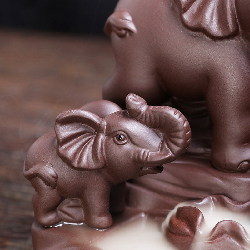 Elephant Purple Clay Incense Burner – Baby elephant close-up with backflow smoke pooling at base, ceramic detail