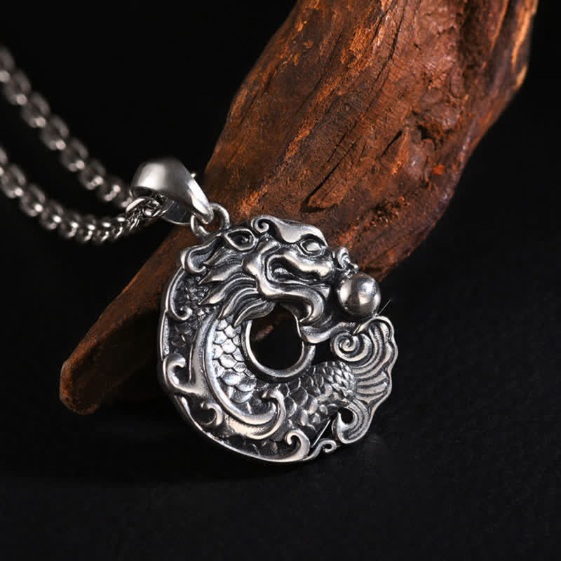 Dragon Koi Wealth Pendant - macro shot of dragon head and koi body transition, necklace