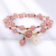 Strawberry quartz double-strand bracelet with natural pink inclusions garnet accent beads gold bezel centerpiece clear crystal leaf charm and pink bead drop
