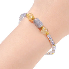 Moonstone Strawberry Quartz Tourmaline Bracelet – Moonstone bracelet with PiXiu worn on wrist, white background, wellness
