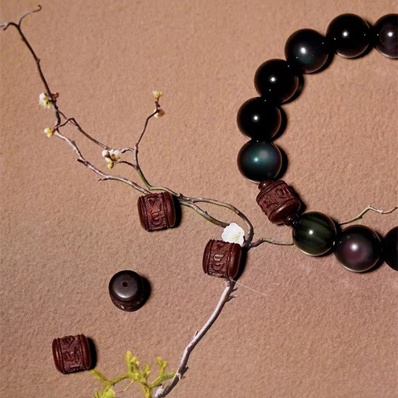 Gold Sheen & Rainbow Obsidian Fu Bracelet – styled with blossoms on wood, artisan bead bracelet