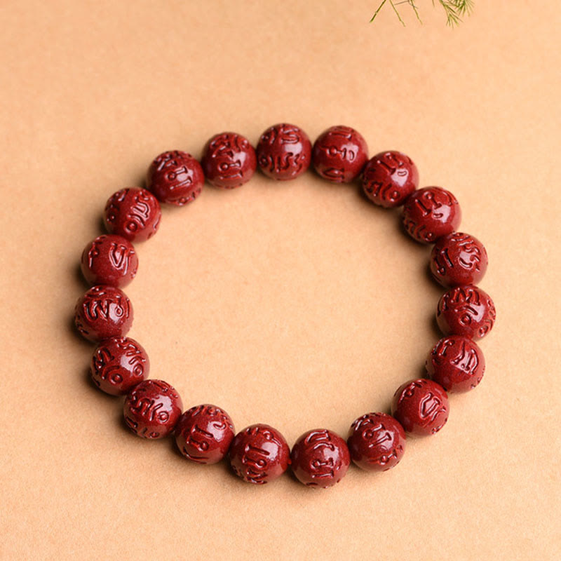 Cinnabar Om Mani Padme Hum Bracelet – carved oxblood red mantra beads on kraft paper, spiritual bracelet