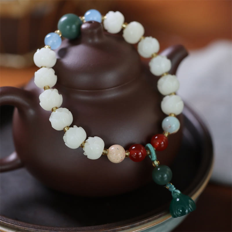 Carved Bodhi Seed Lotus Bead Peace Bracelet - on traditional teapot with lotus pod charm, zen