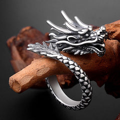 Sterling Silver Dragon Ring - oxidized silver dragon head resting on driftwood, scale texture, protective