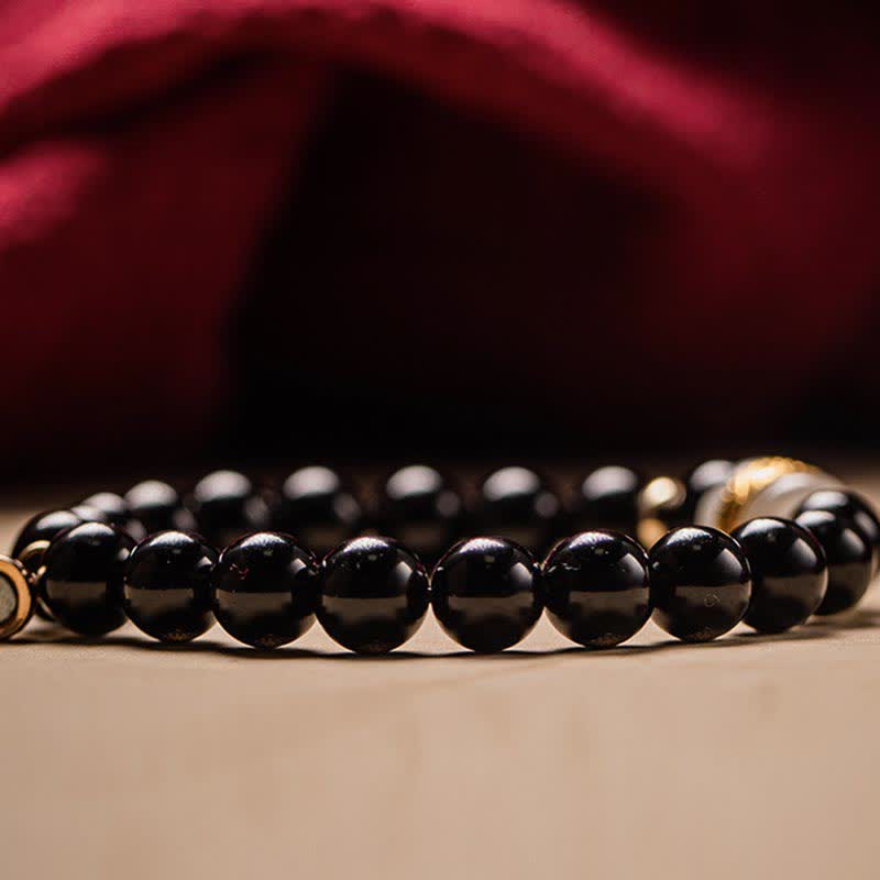 Black Obsidian Jade Bracelet – Ground-level perspective highlighting bead polish and reflective surface quality