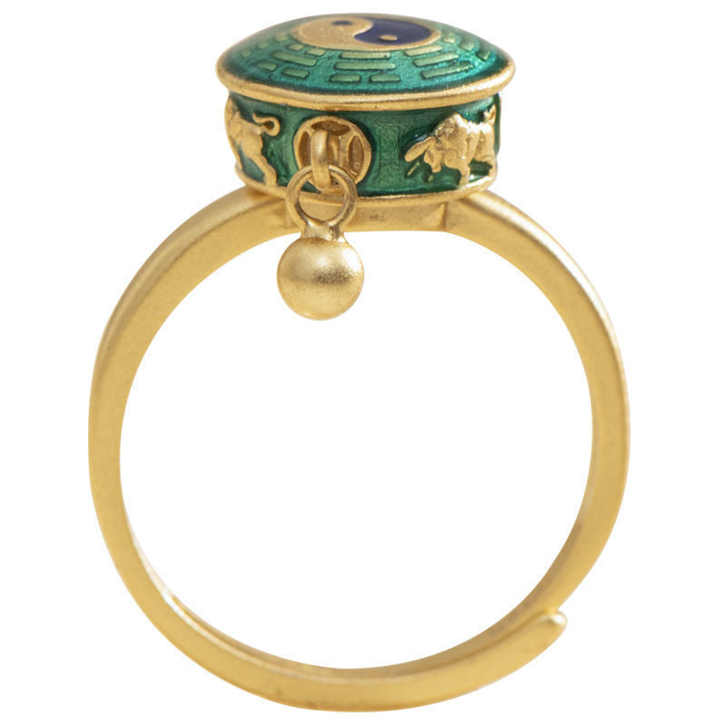 Yin Yang Copper Rotatable Ring - gold spinner with green enamel bagua and relief decor, white bg
