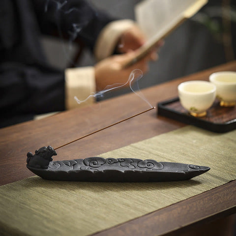 Pixiu Ceramic Incense Burner with rising smoke, tea cups, sage-green mat, bokeh figure – incense burner for meditation Main image