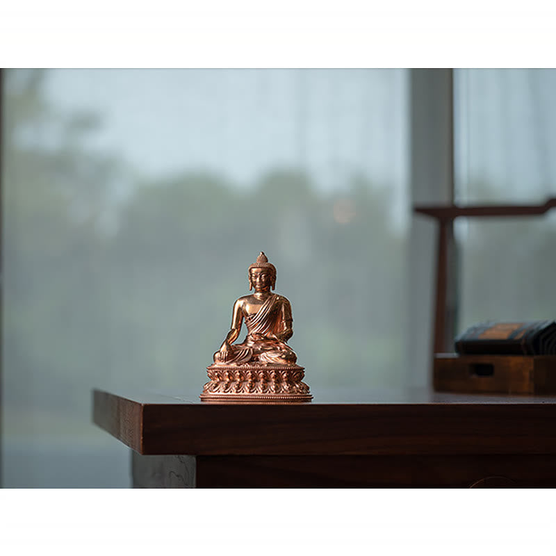 Shakyamuni Copper Statue – warm lamplight on copper surface creating golden glow, evening calm ambiance