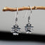 925 Sterling Silver Lotus Flower Enlightenment Earrings hanging on branch front view