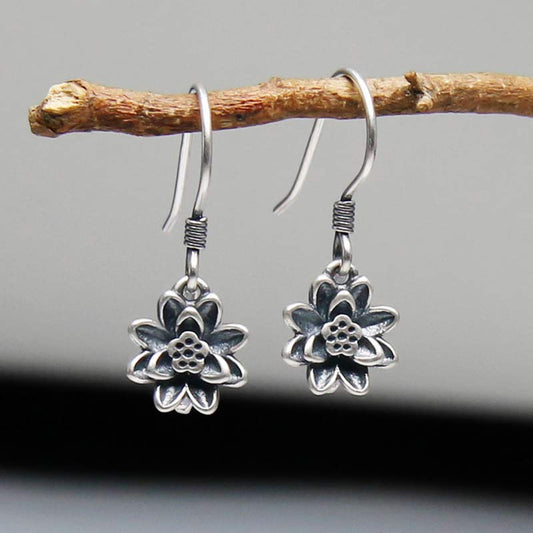 925 Sterling Silver Lotus Flower Enlightenment Earrings hanging on branch front view