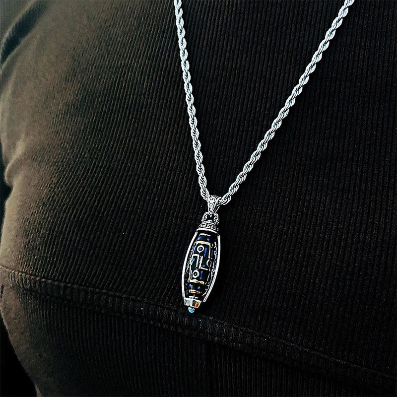 Nine-Eye Dzi Bead Pendant - Worn on black sweater showing natural drape and scale