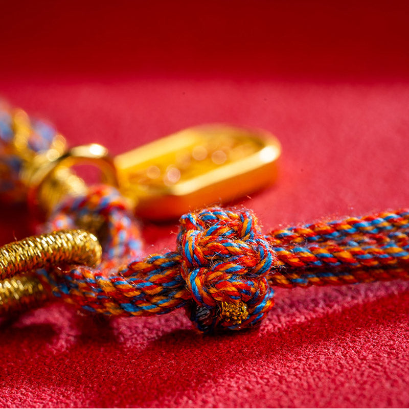 Multicolored Tibetan Om Mani Padme Hum Ruyi Braided Bracelet – Close-up knot on red, handmade bracelet