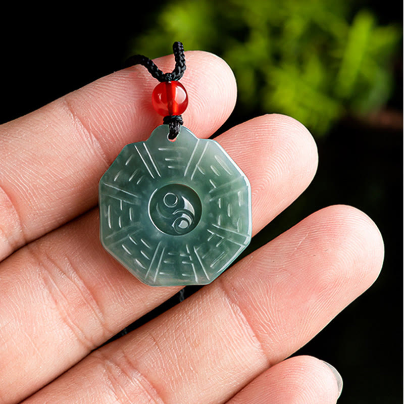 Natural Jade Bagua Yin Yang Pendant - Handheld jade bagua pendant showing size, green stone necklace