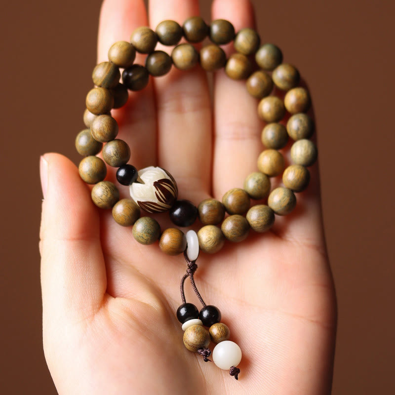 Green Sandalwood Lotus Bracelet – double wrap in palm, earthy olive beads and lotus focal