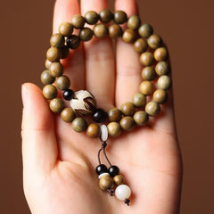 Green Sandalwood Lotus Bracelet – double wrap in palm, earthy olive beads and lotus focal