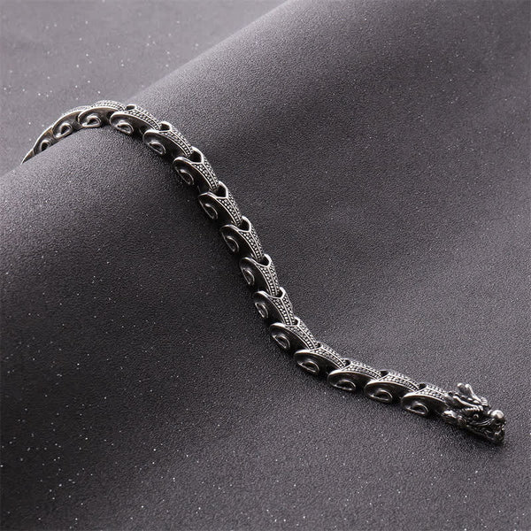 Dragon Necklace Bracelet Set - Scaled dragon bracelet on dark textured fabric, Protection